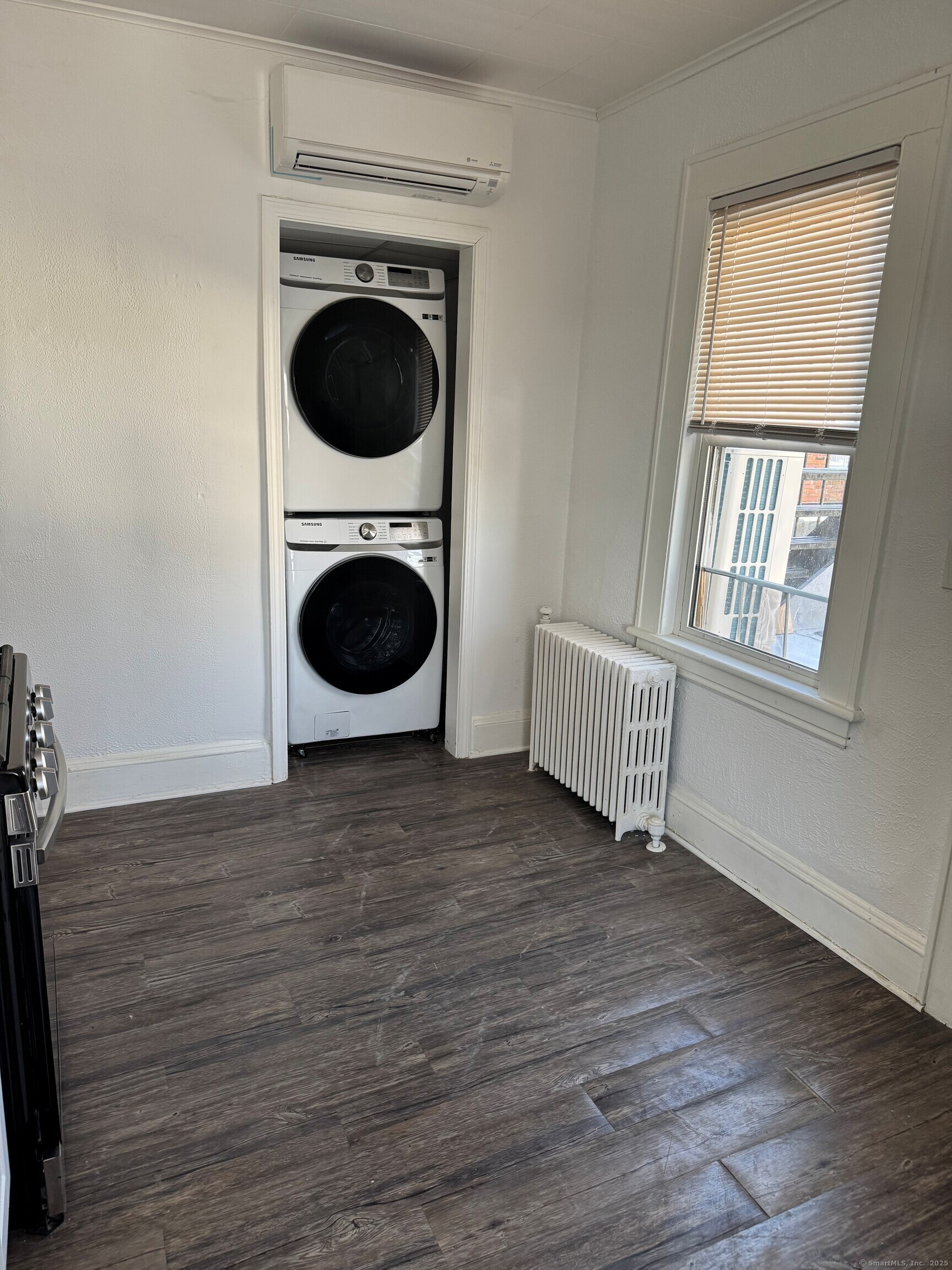 3142 Fairfield Avenue, Unit 2 Bridgeport, CT 06605 - Photo 10 of 11 a view of a hallway with washer and dryer