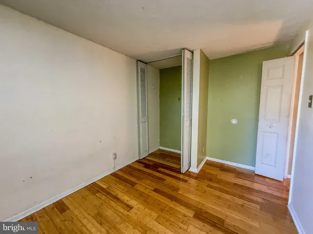 a view of a room with wooden floor
