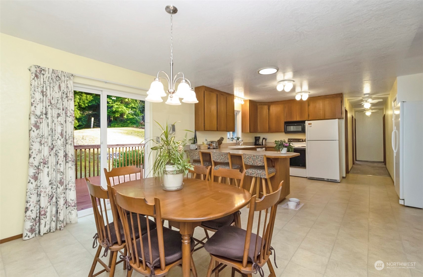 1331 Carlson Road Snohomish, WA 98290 - Photo 8 of 38 a dining room with furniture a window and kitchen view