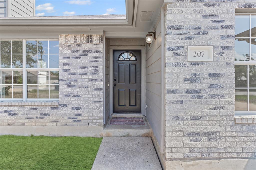 207 Panther Path Liberty Hill, TX 78642 - Photo 2 of 19 a view of front door of house with yard