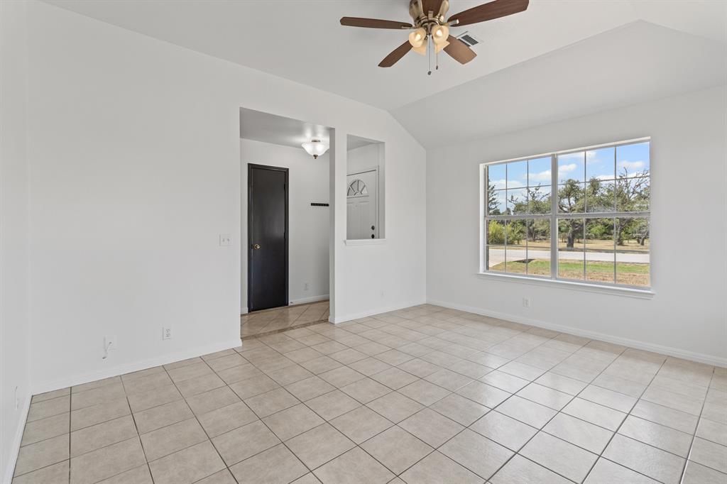 207 Panther Path Liberty Hill, TX 78642 - Photo 4 of 19 a view of an empty room with window