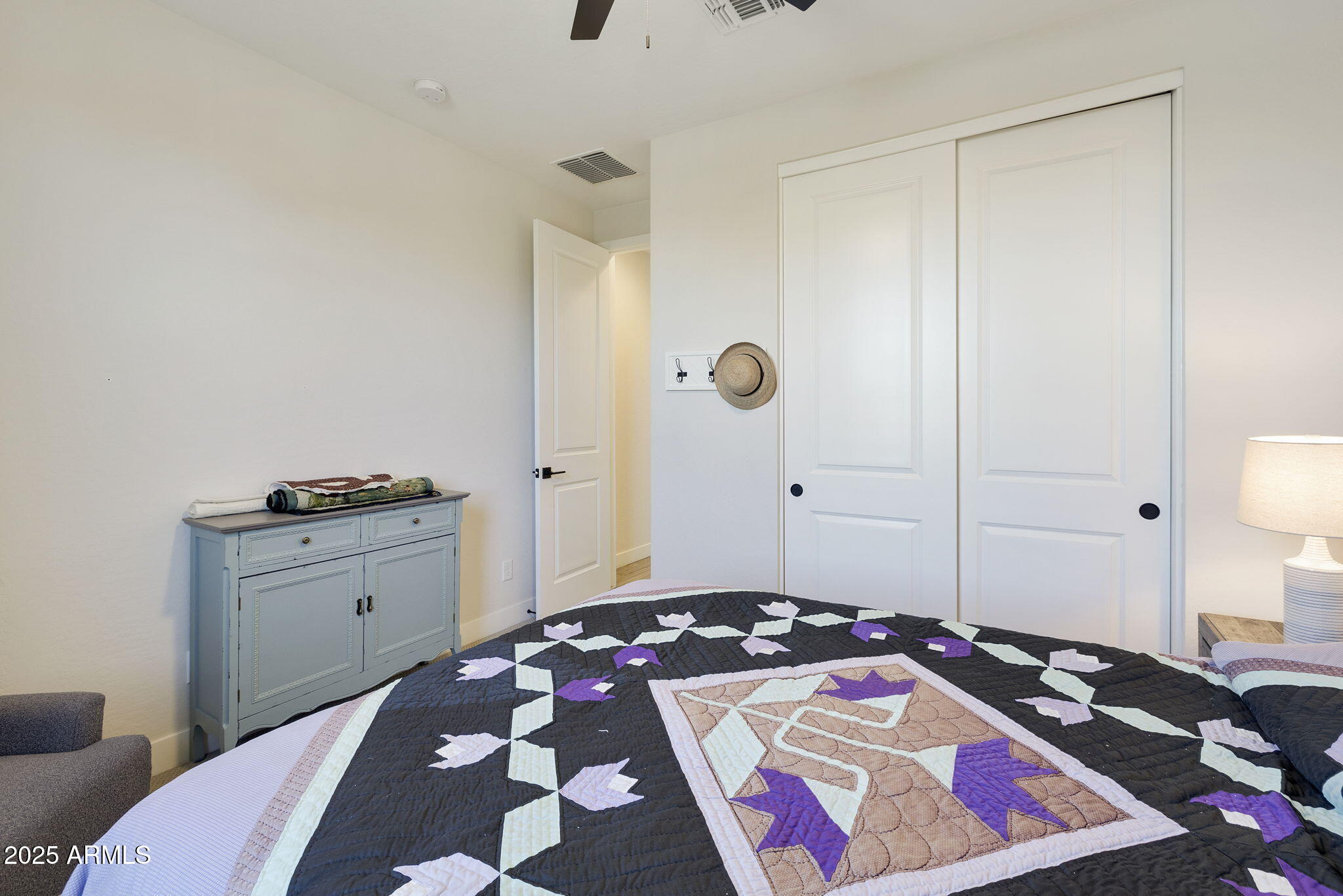4557 South Element Mesa, AZ 85212 - Photo 11 of 34 a bedroom with a bed and a cabinets
