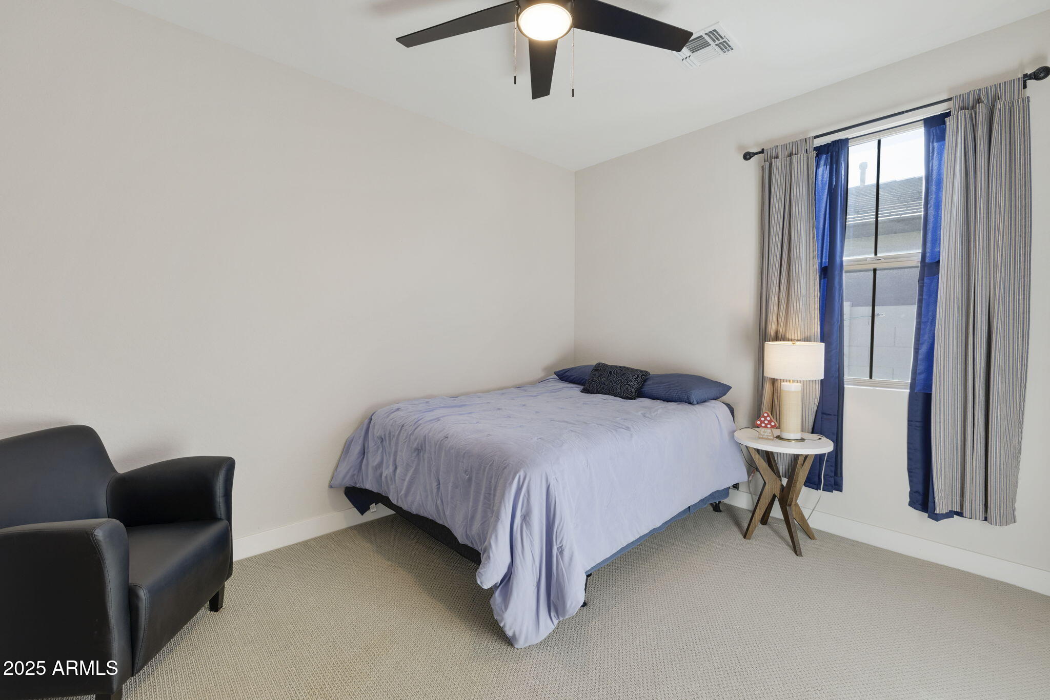 4557 South Element Mesa, AZ 85212 - Photo 13 of 34 a bedroom with a bed and large windows