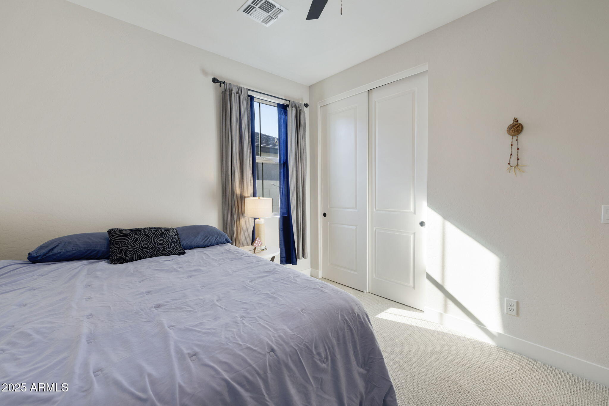 4557 South Element Mesa, AZ 85212 - Photo 14 of 34 a bedroom with a bed and a window