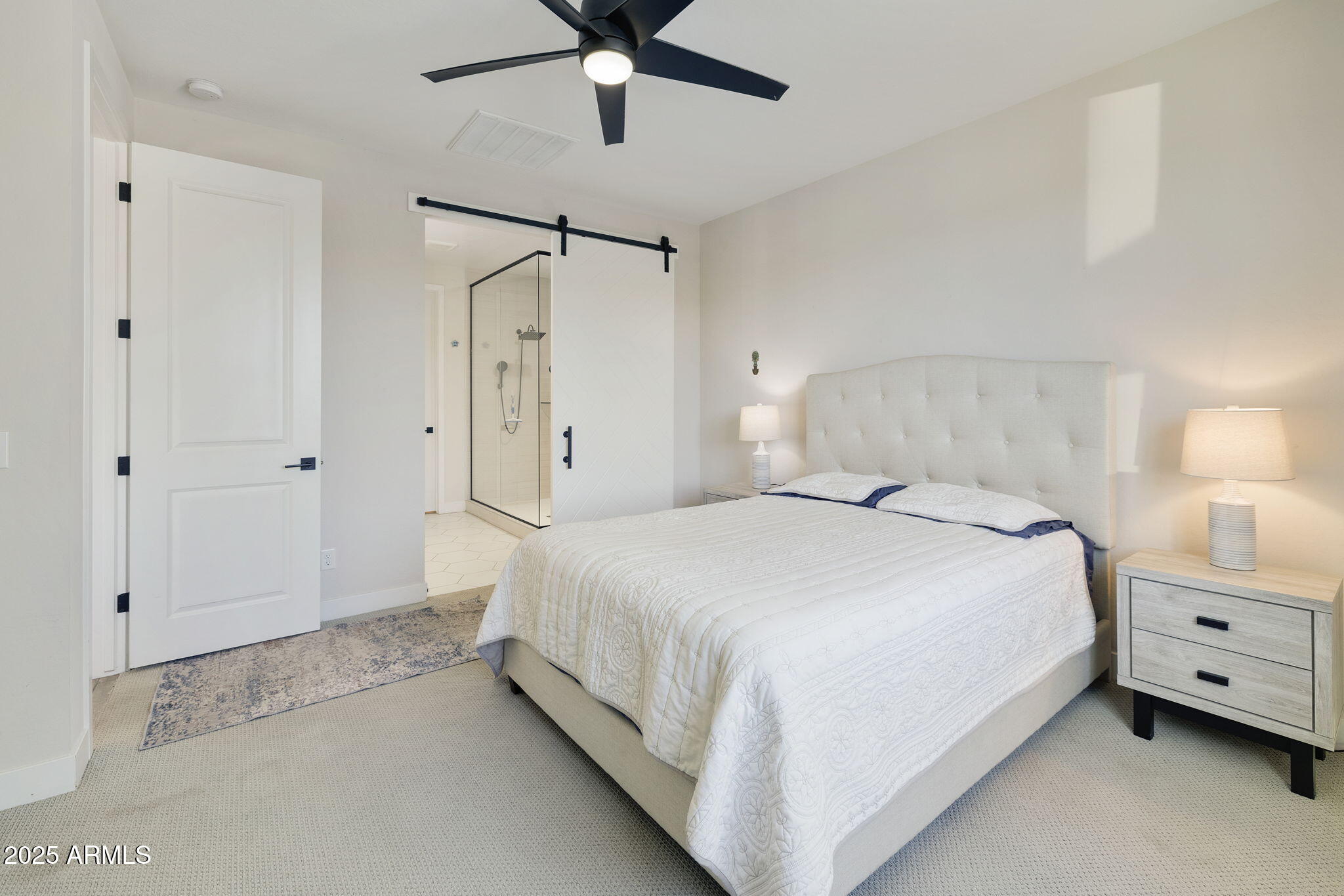 4557 South Element Mesa, AZ 85212 - Photo 16 of 34 a bedroom with a bed and a ceiling fan