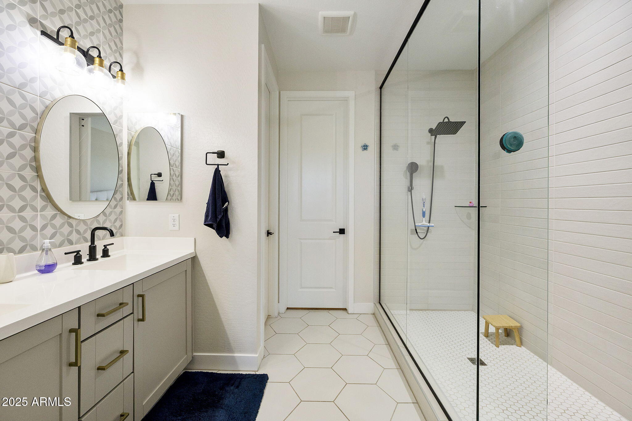 4557 South Element Mesa, AZ 85212 - Photo 18 of 34 a spacious bathroom with a double vanity sink mirror and shower
