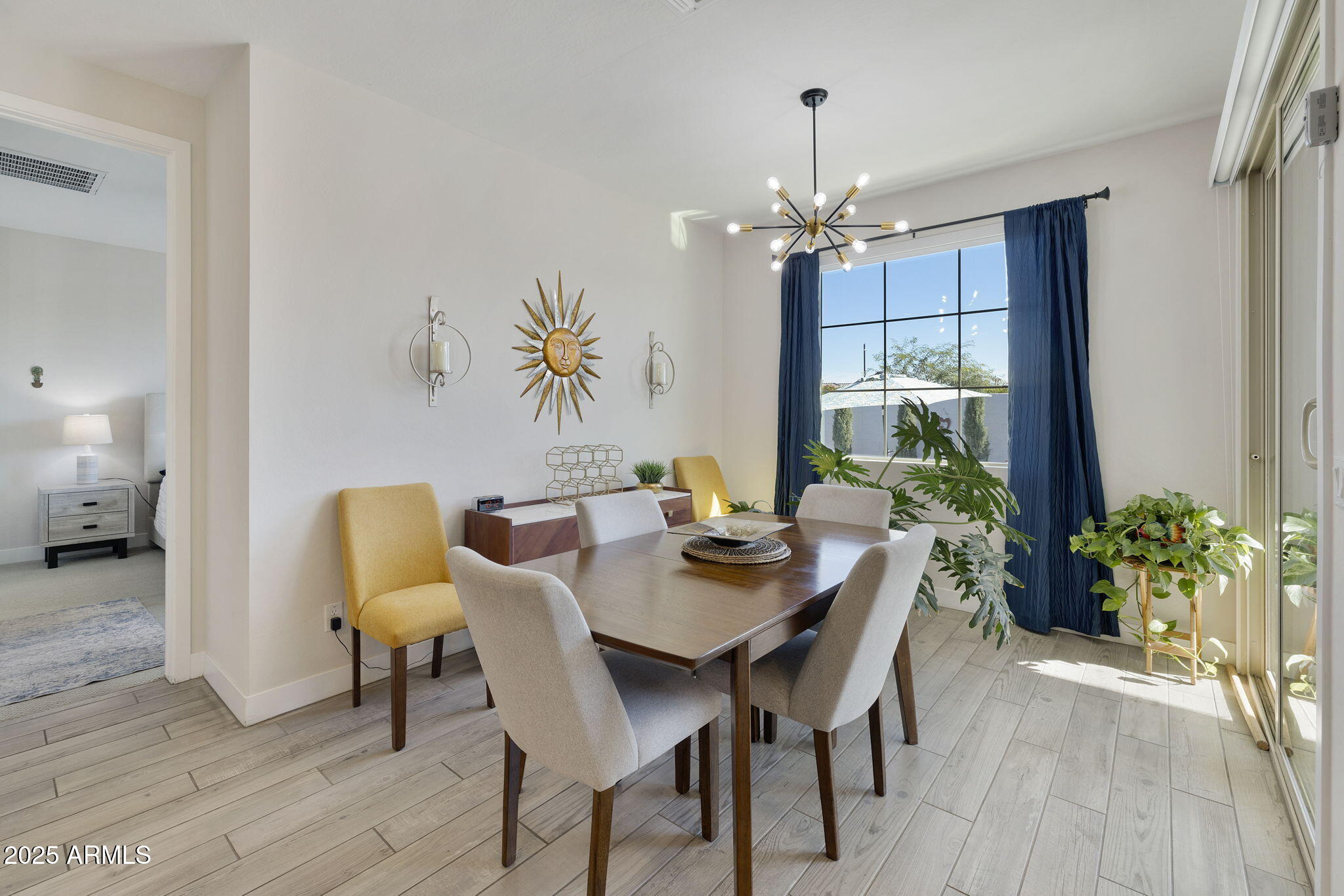 4557 South Element Mesa, AZ 85212 - Photo 20 of 34 a view of a dining room with furniture and chandelier