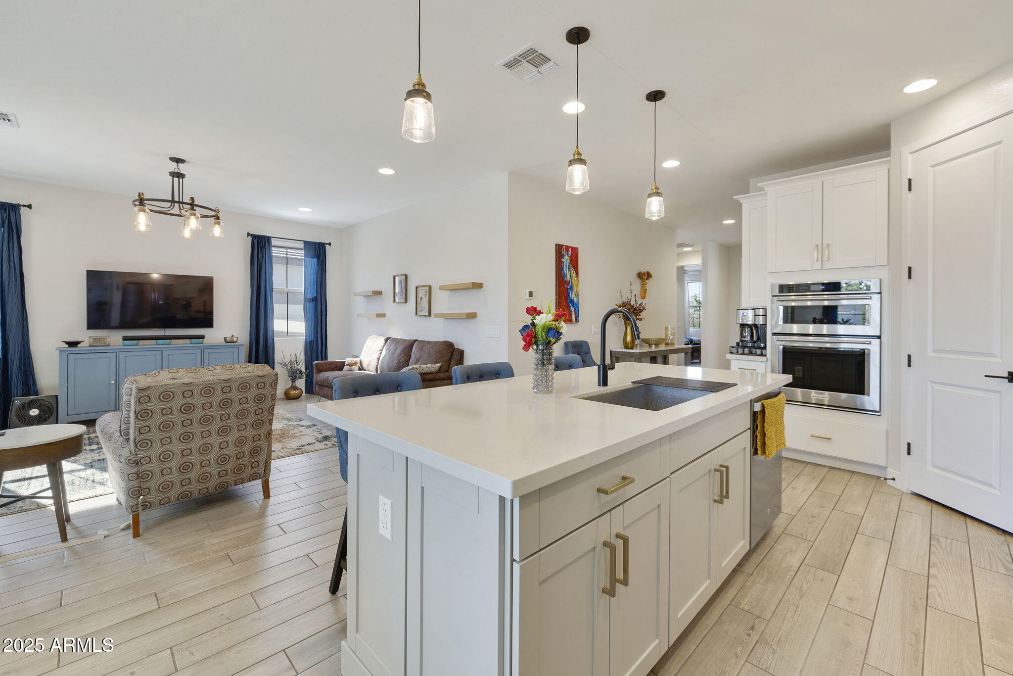 4557 South Element Mesa, AZ 85212 - Photo 25 of 34 a kitchen with counter top space a sink stainless steel appliances and cabinets