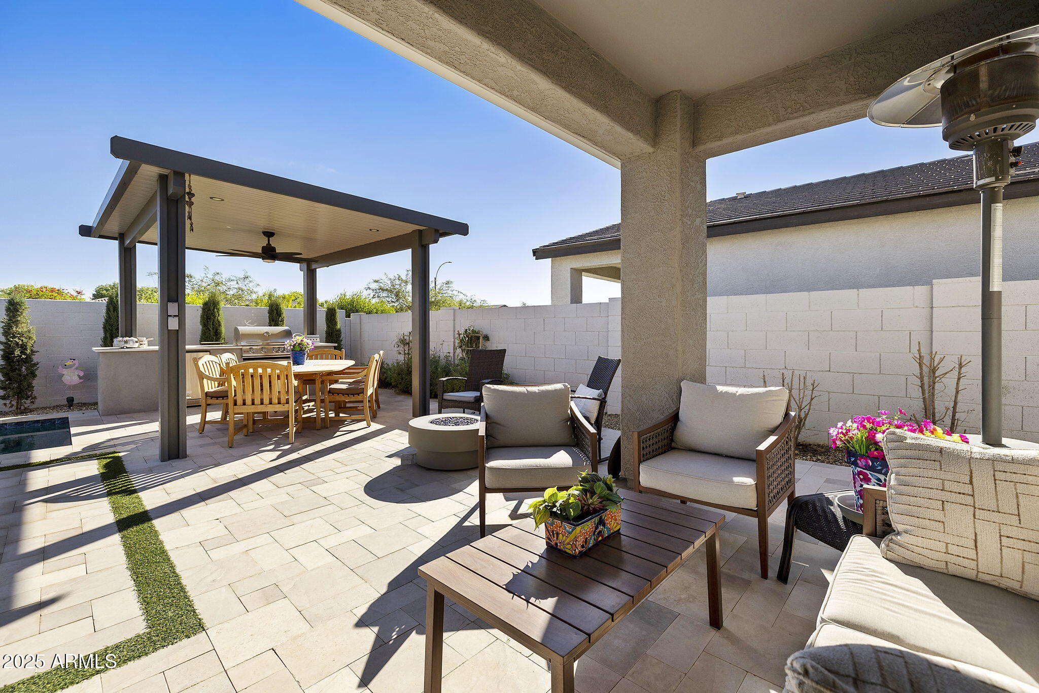 4557 South Element Mesa, AZ 85212 - Photo 6 of 34 a outdoor space with patio the couches and a dining table with chairs