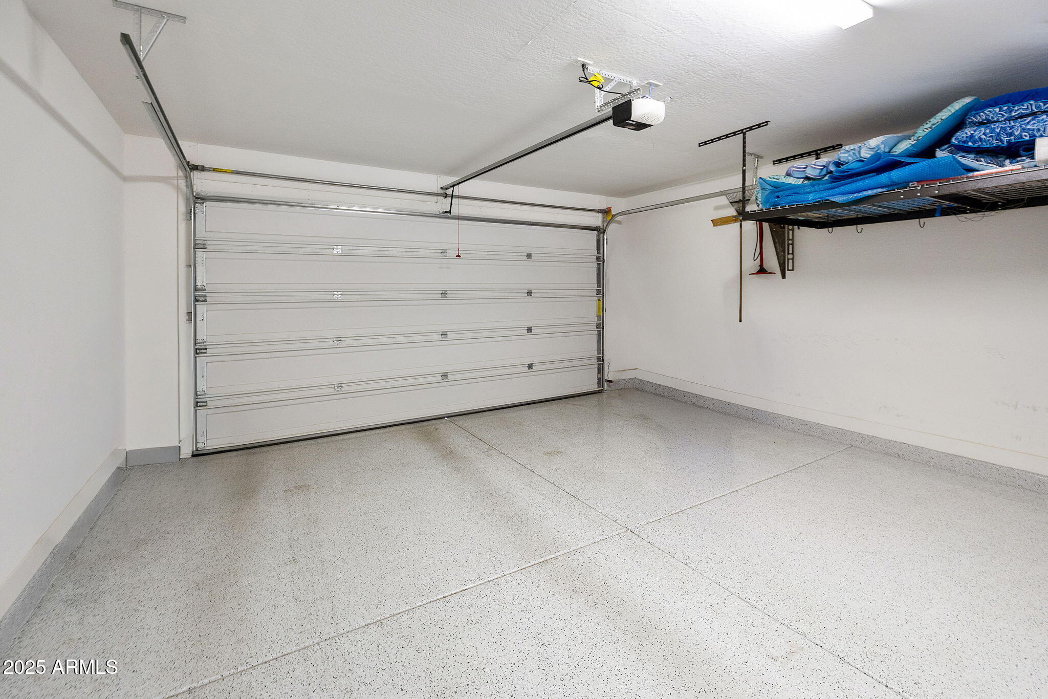 4557 South Element Mesa, AZ 85212 - Photo 9 of 34 a view of a room with racks on the wall