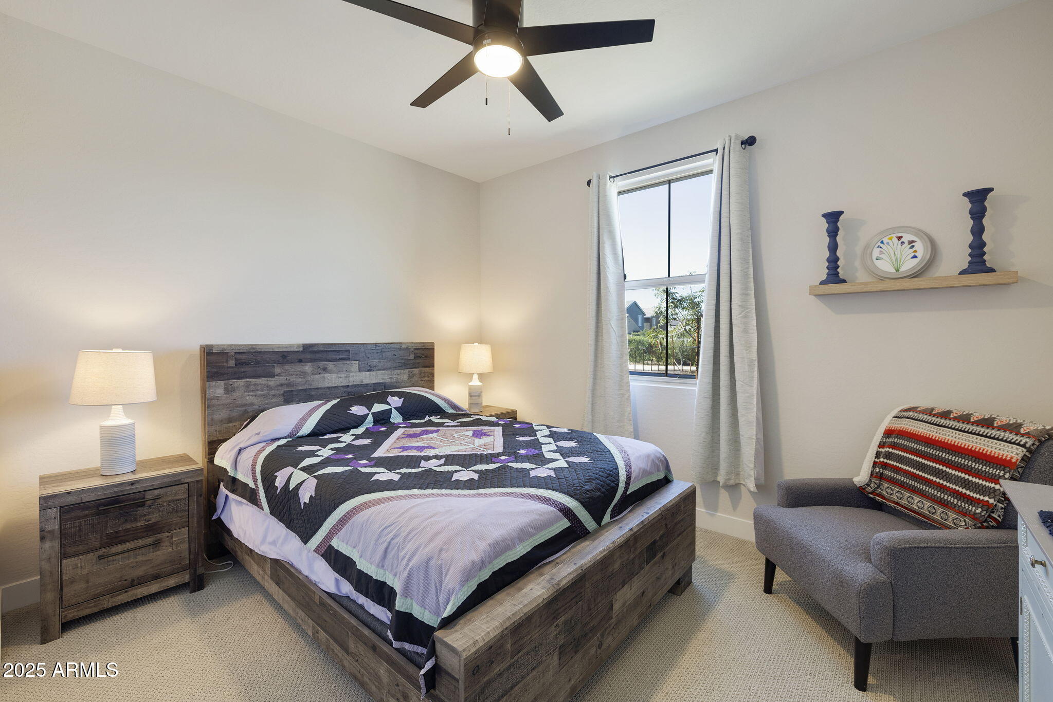 4557 South Element Mesa, AZ 85212 - Photo 10 of 34 a bedroom with a bed and a couch