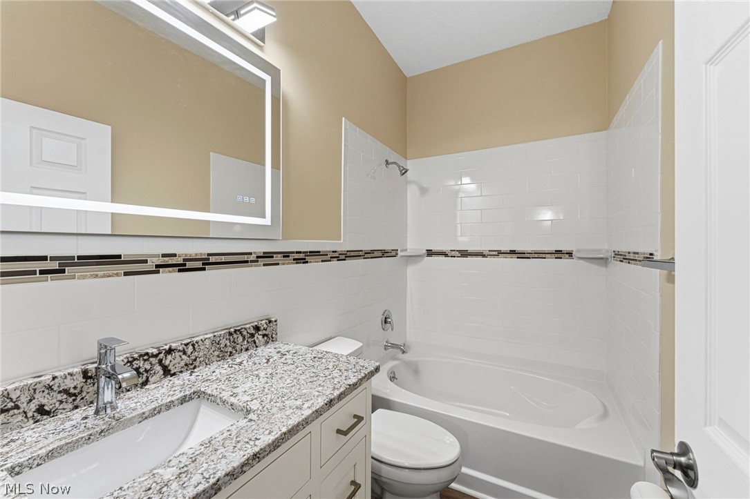 13011 West Lake Road Vermilion, OH 44089 - Photo 24 of 29 Fully renovated Upstairs Bath new bathtub and surround, new vanity and sink, new toilet