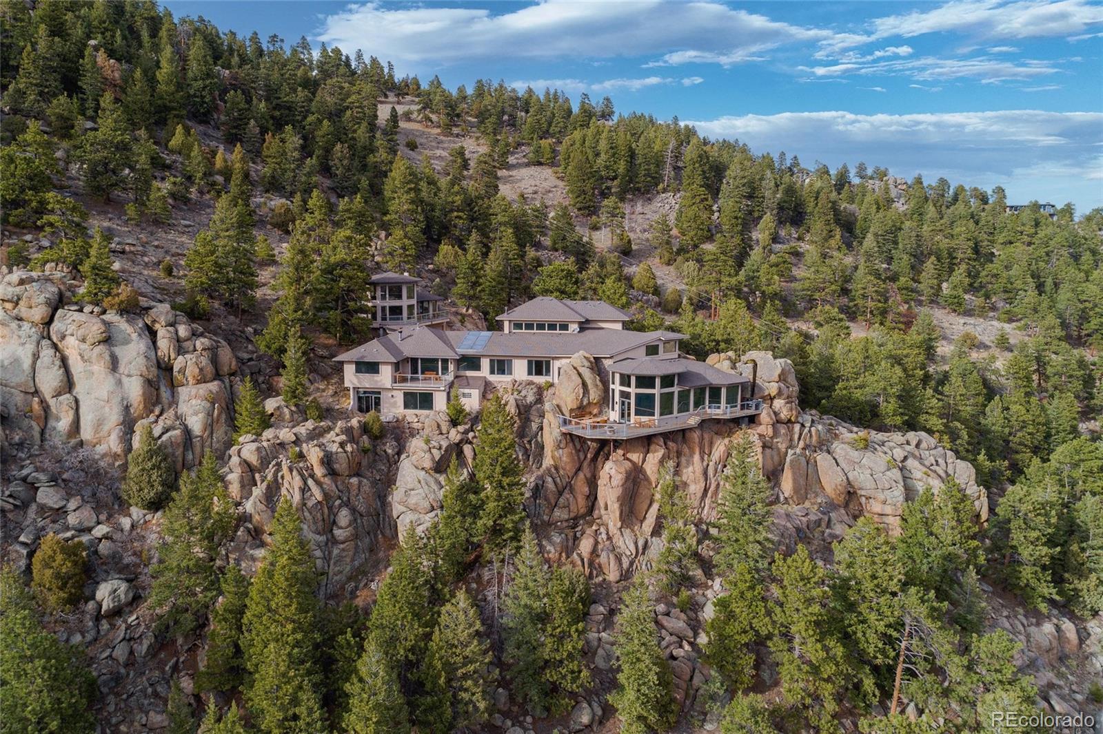 25580 Sunset Lane Evergreen, CO 80439 - Photo 1 of 40 a view of a houses with a lake