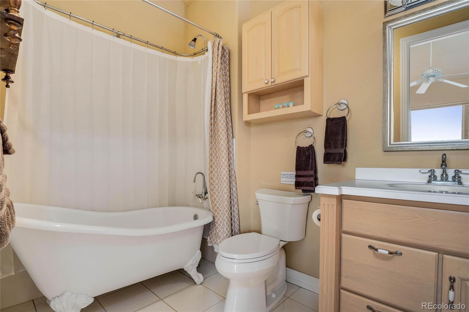 25580 Sunset Lane Evergreen, CO 80439 - Photo 25 of 40 a bathroom with a sink toilet and shower