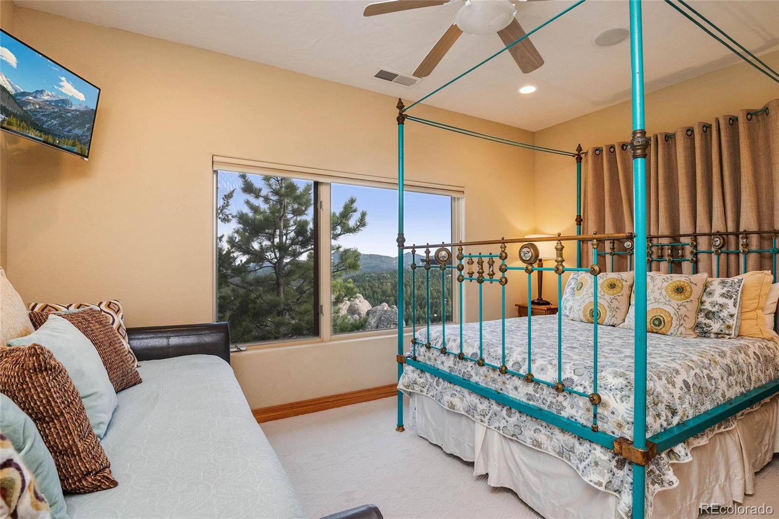 25580 Sunset Lane Evergreen, CO 80439 - Photo 26 of 40 a view of staircase with furniture and a window