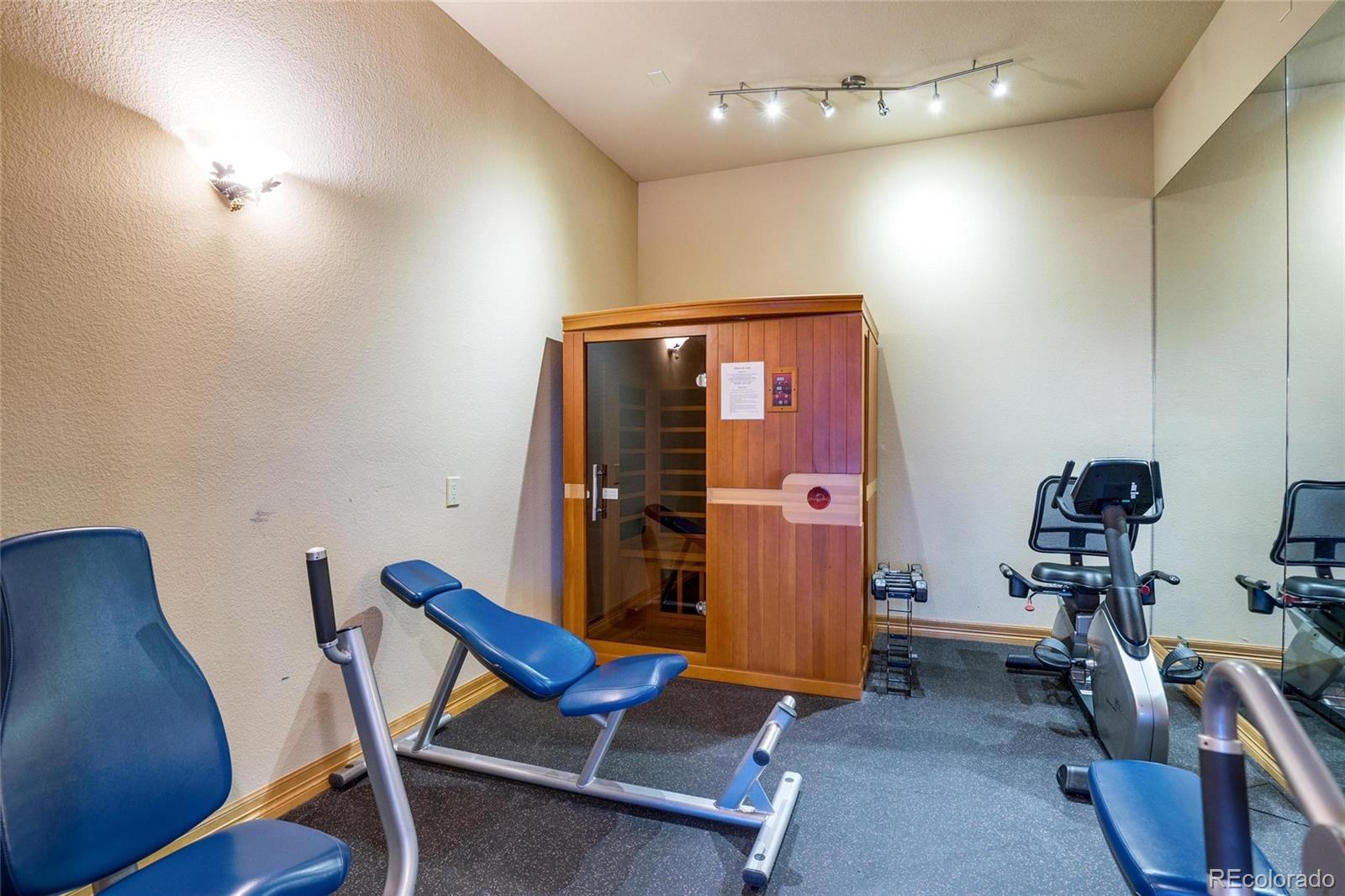 25580 Sunset Lane Evergreen, CO 80439 - Photo 36 of 40 a view of a room with gym equipment