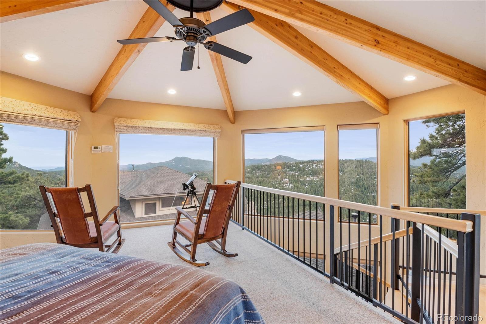 25580 Sunset Lane Evergreen, CO 80439 - Photo 40 of 40 a view of balcony with furniture and wooden floor