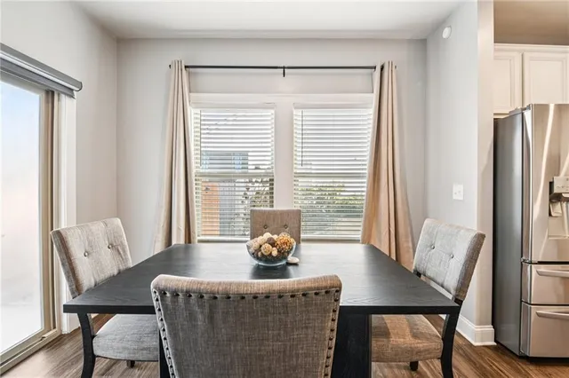 a large kitchen with kitchen island stainless steel appliances a large center island attached withe sink