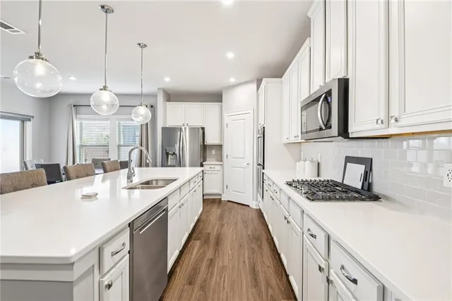 an empty room with closet and fan