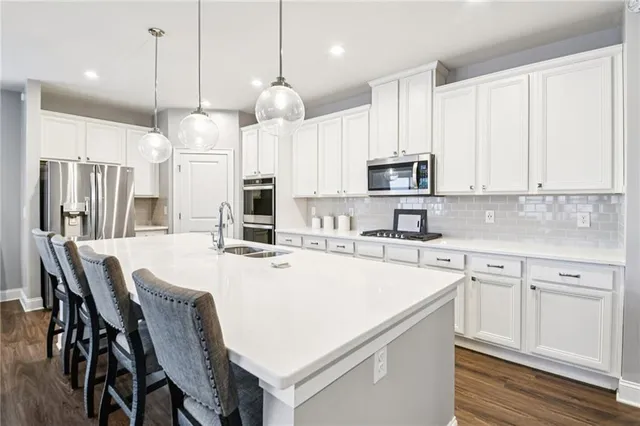 a bathroom with a double vanity sink mirror double and shower