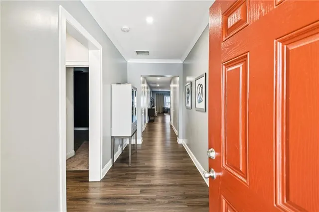 a living room with furniture flat screen tv and window