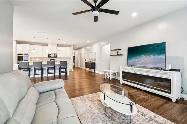 a view of a dining room with furniture and wooden floor