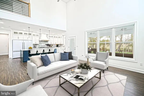 a bedroom with furniture and a large window