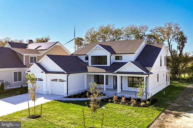 a front view of house with yard outdoor seating and barbeque oven