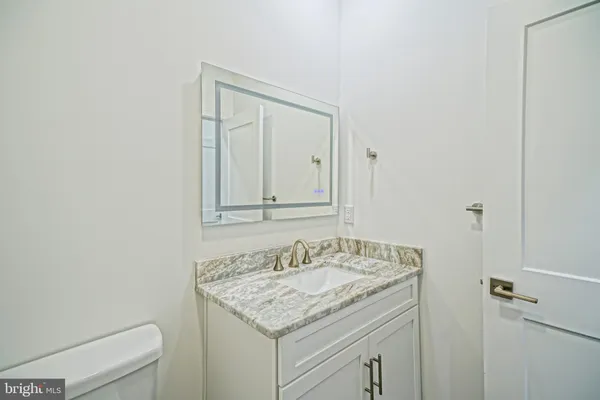 a bedroom with a large bed and a couch