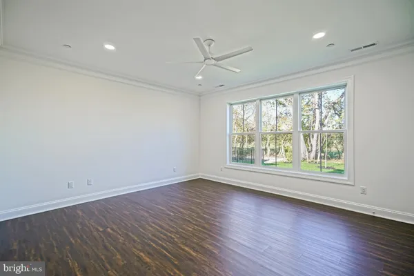 a bedroom with furniture and flat screen tv