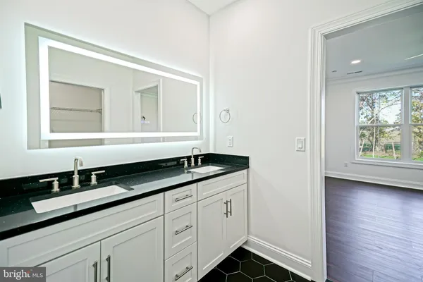 a kitchen with a sink and a white cabinets