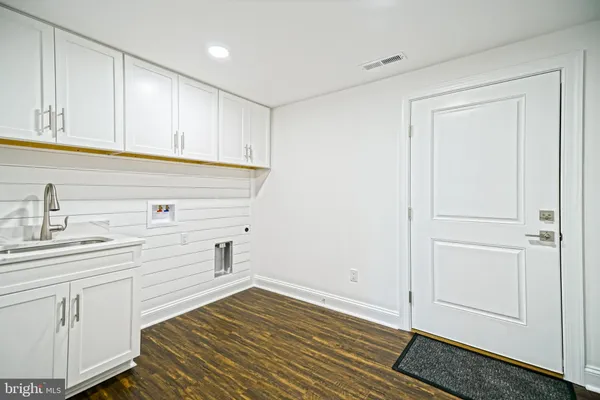 a spacious bedroom with a bed and a couch