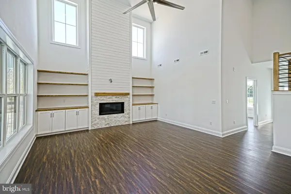a kitchen with granite countertop white cabinets and sink