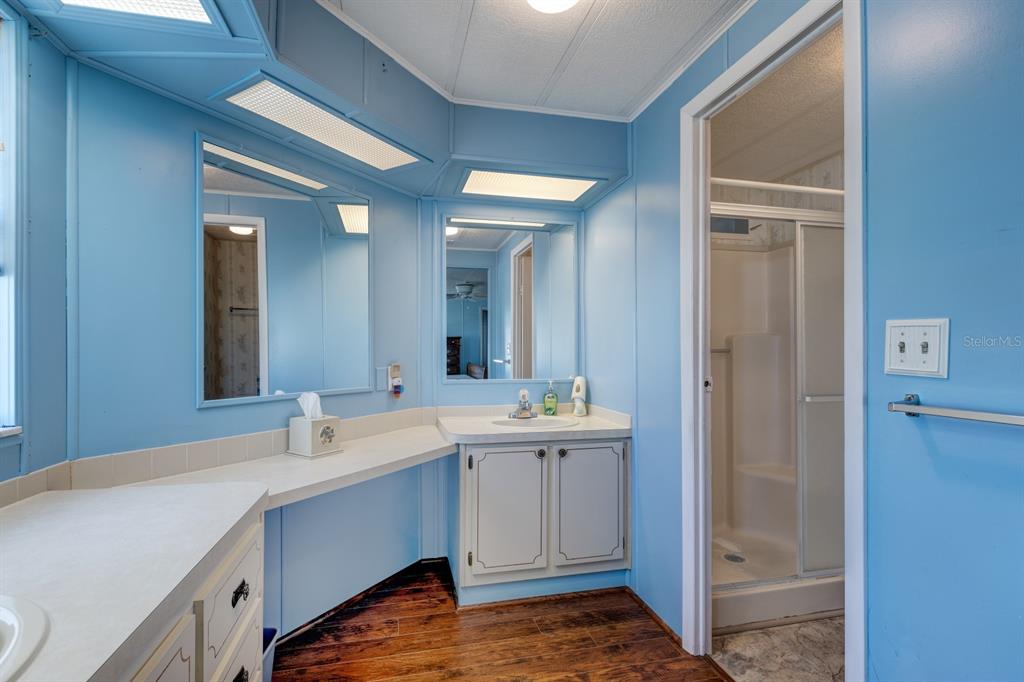 1543 Apache Circle Tavares, FL 32778 - Photo 11 of 19 a bathroom with a sink and a mirror