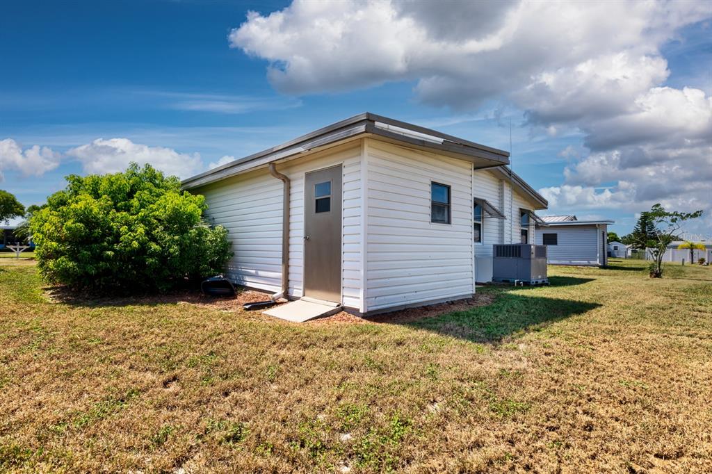 1543 Apache Circle Tavares, FL 32778 - Photo 12 of 19 a view of a house with a yard