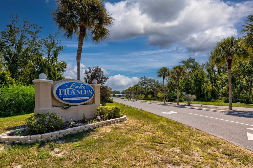 1543 Apache Circle Tavares, FL 32778 - Photo 13 of 19 a view of a street with a yard and trees