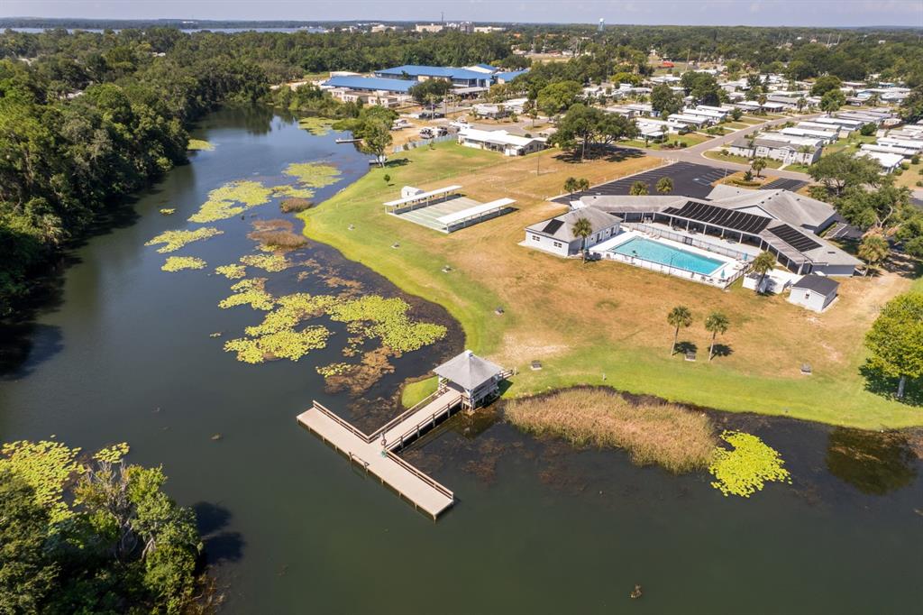 1543 Apache Circle Tavares, FL 32778 - Photo 17 of 19 an aerial view of residential houses with outdoor space