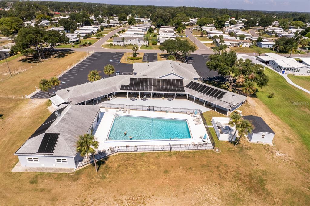 1543 Apache Circle Tavares, FL 32778 - Photo 18 of 19 an aerial view of a house with a swimming pool