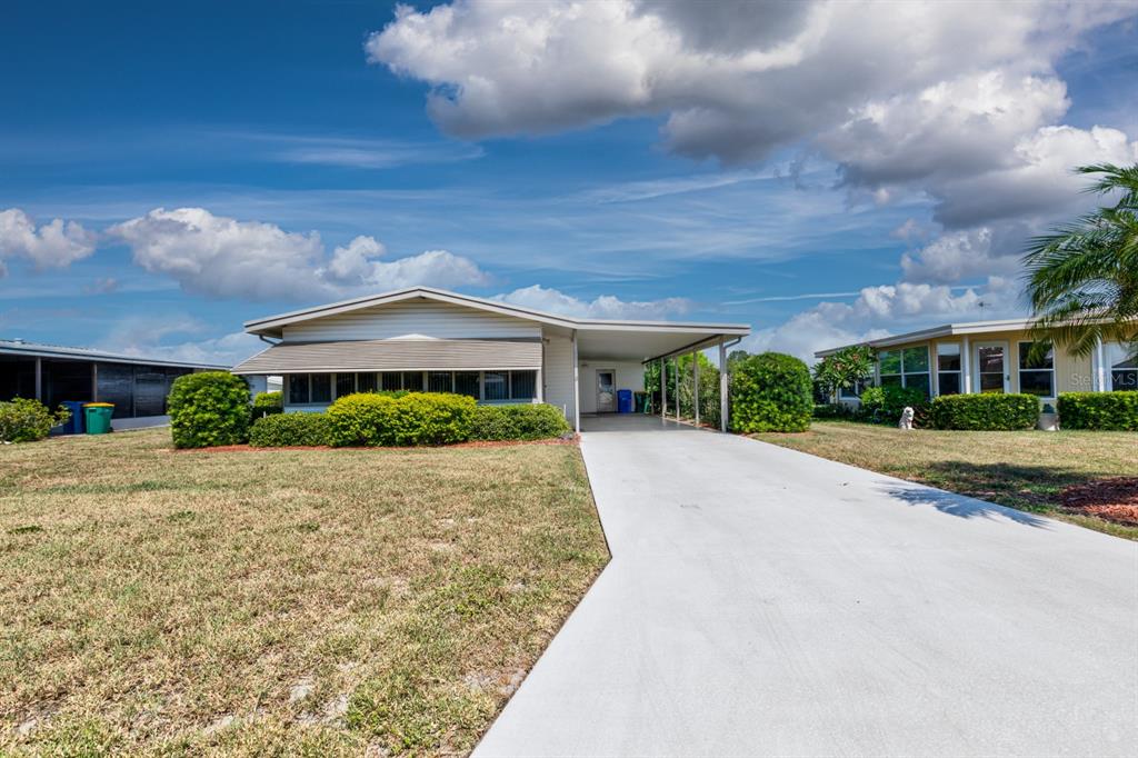 1543 Apache Circle Tavares, FL 32778 - Photo 19 of 19 a front view of house with yard and green space
