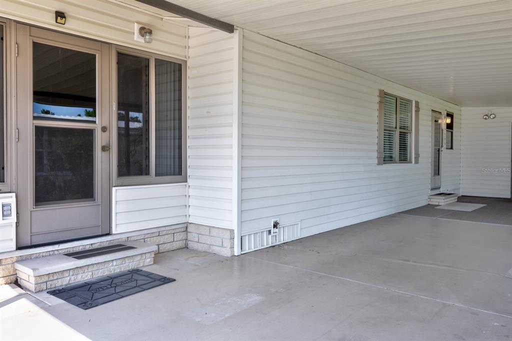 1543 Apache Circle Tavares, FL 32778 - Photo 2 of 19 a view of a house entryway