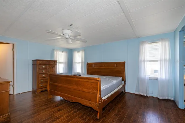 a bedroom with a bed and window