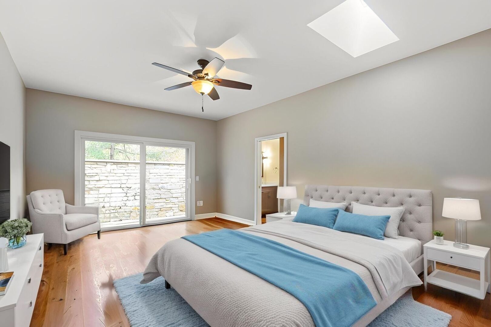 12 Rock Ridge Lane Barrington Hills, IL 60010 - Photo 16 of 52 a spacious bedroom with a bed and a chandelier