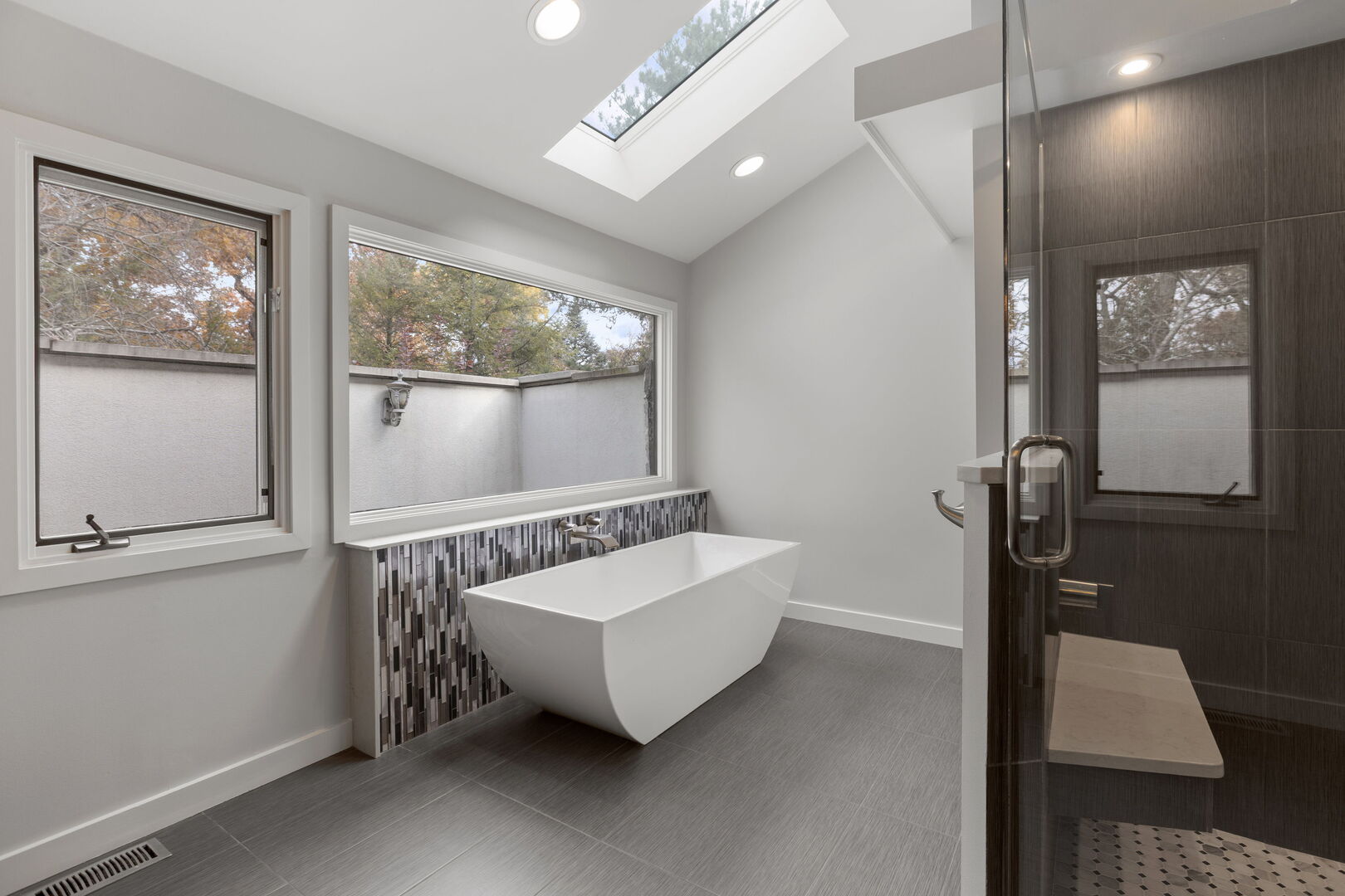 12 Rock Ridge Lane Barrington Hills, IL 60010 - Photo 24 of 52 a bathroom with a bathtub and a shower