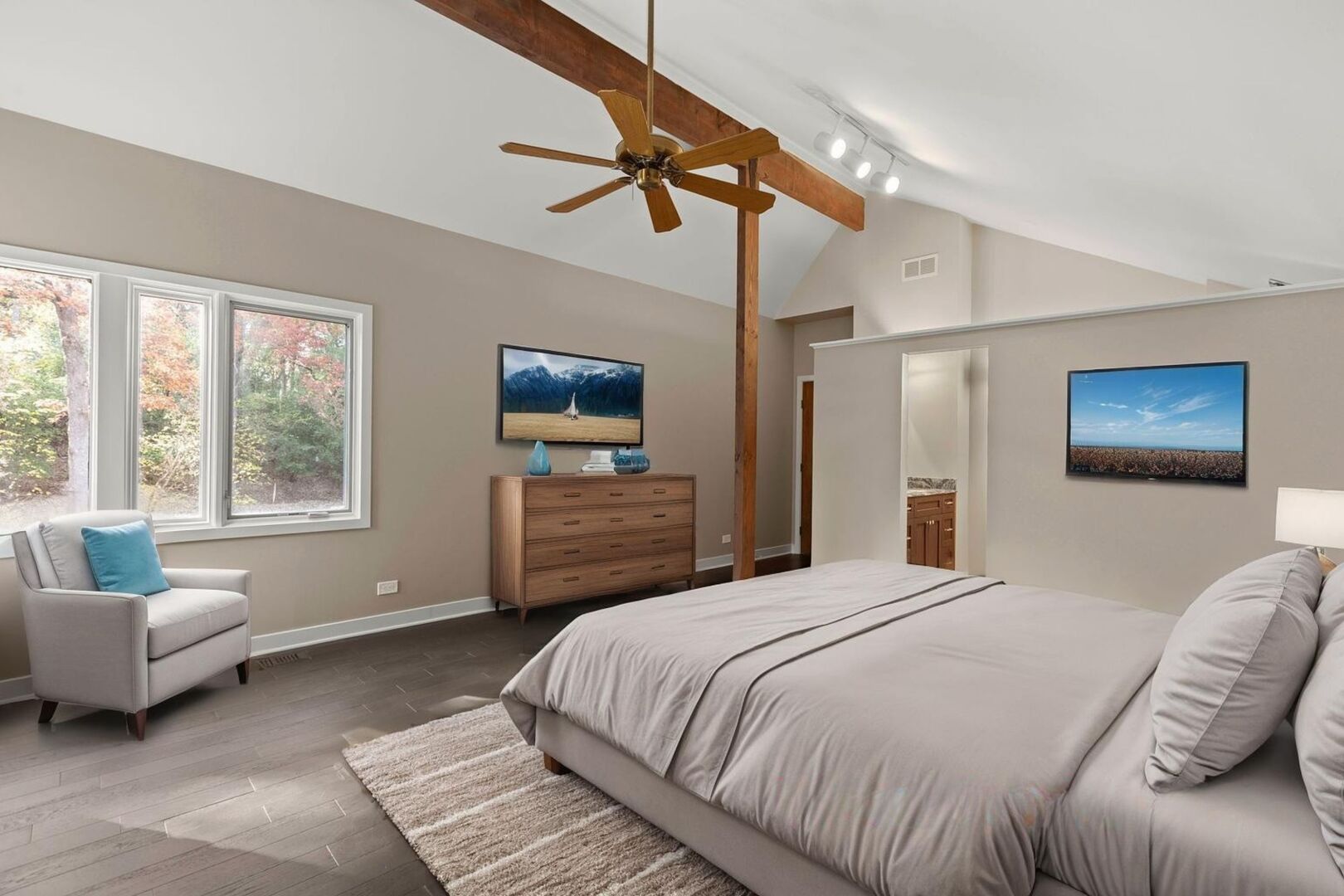 12 Rock Ridge Lane Barrington Hills, IL 60010 - Photo 25 of 52 a bedroom with a bed a couch and a flat screen tv