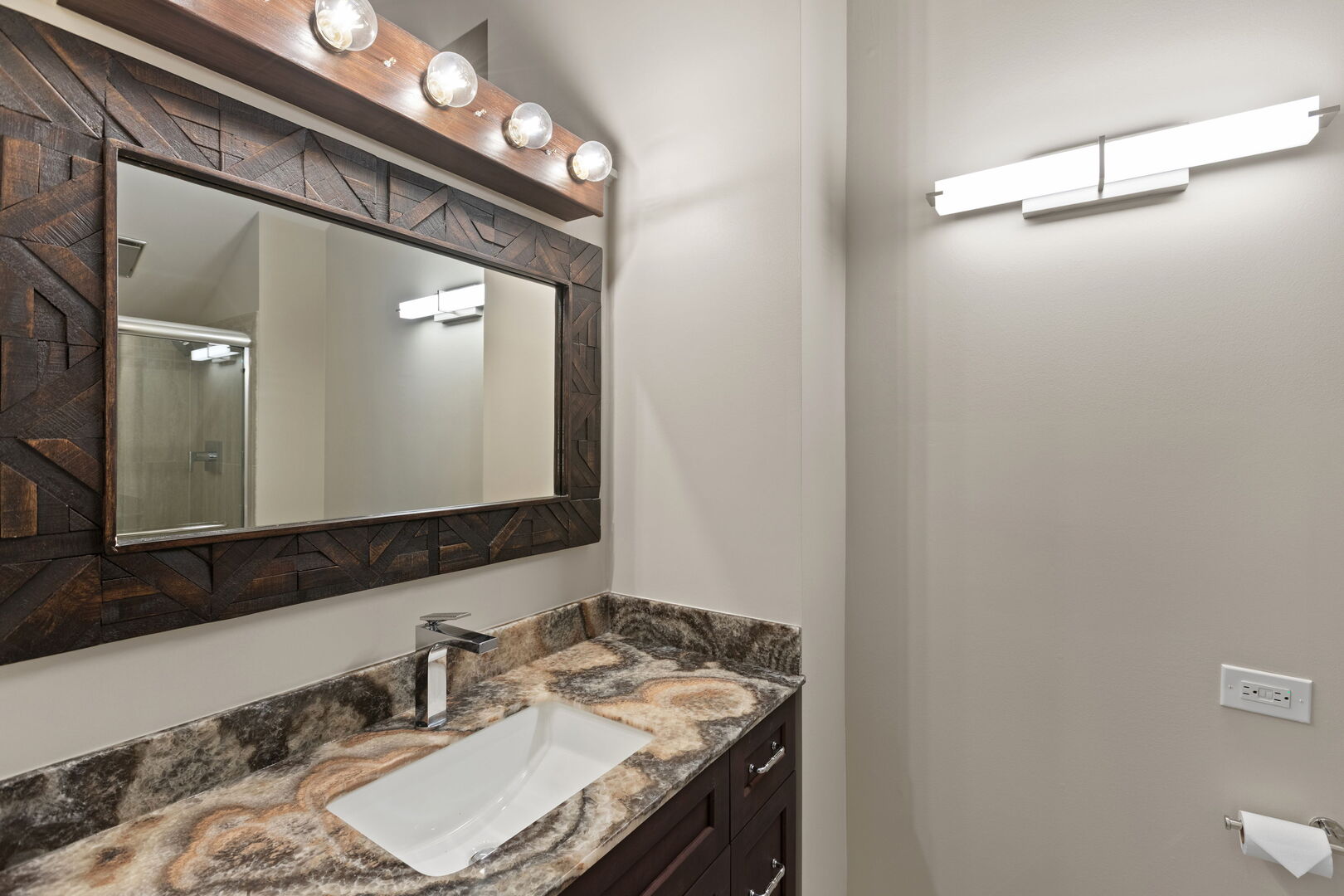 12 Rock Ridge Lane Barrington Hills, IL 60010 - Photo 26 of 52 a bathroom with a sink vanity and a mirror