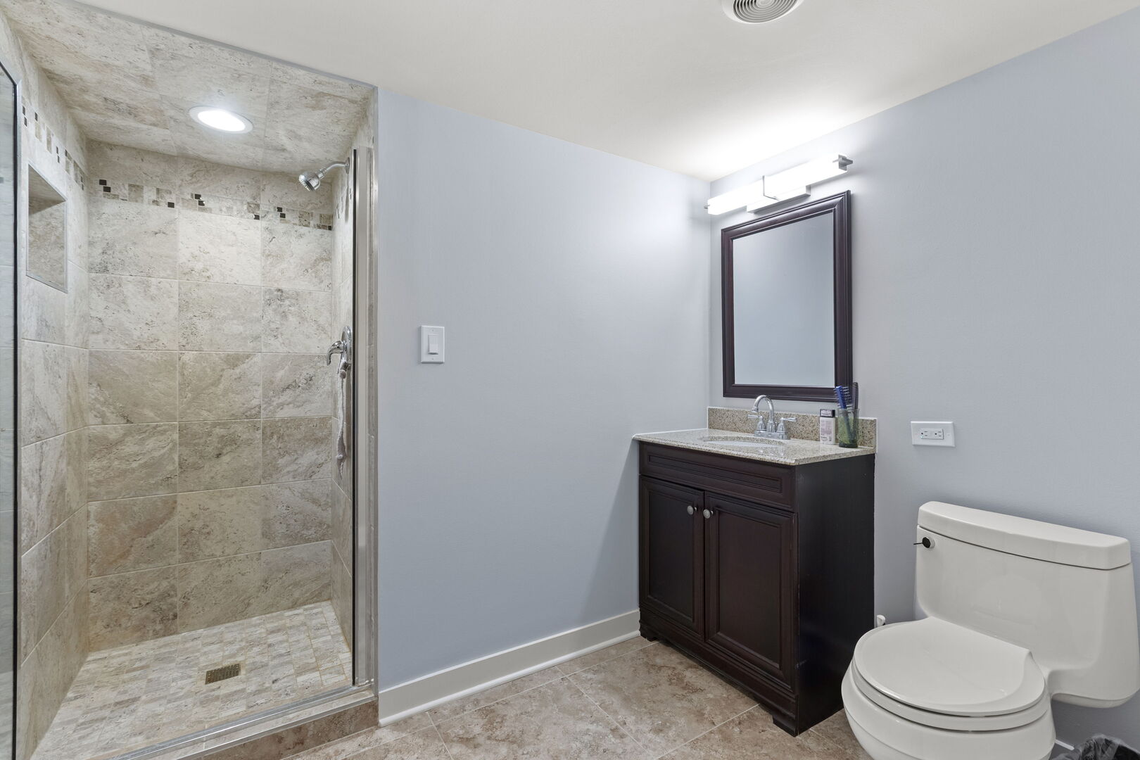 12 Rock Ridge Lane Barrington Hills, IL 60010 - Photo 35 of 52 a bathroom with a toilet a sink and mirror