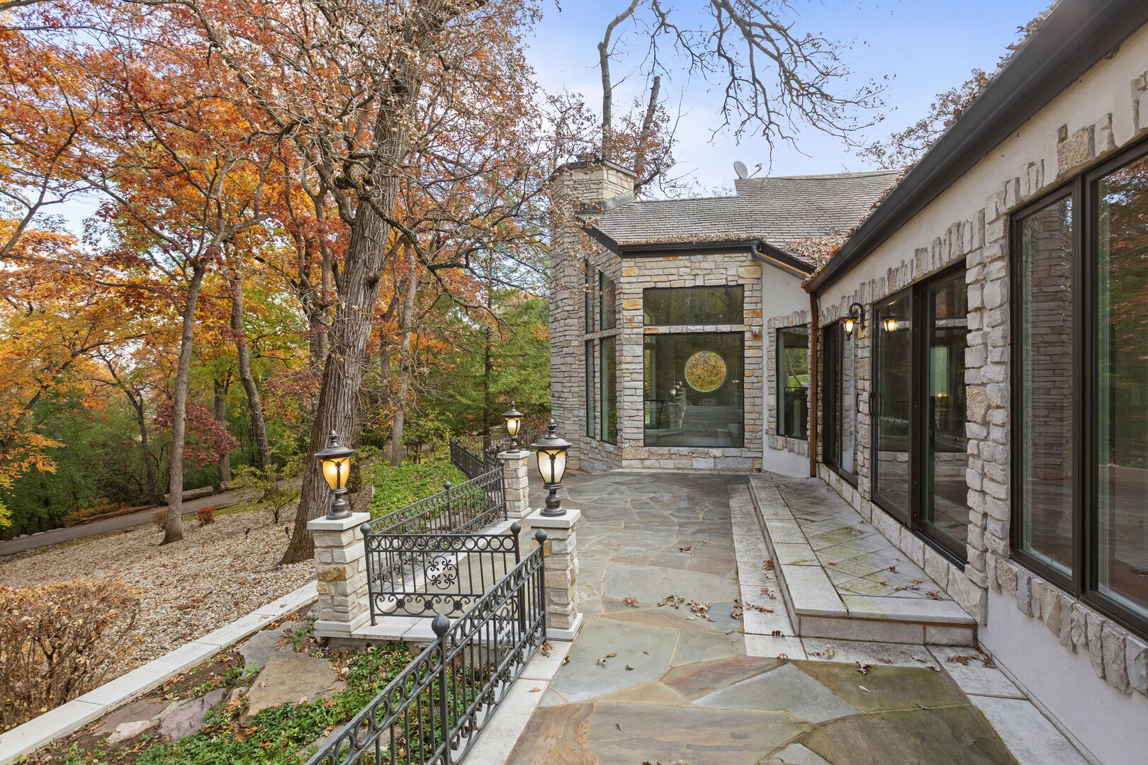 12 Rock Ridge Lane Barrington Hills, IL 60010 - Photo 7 of 52 a view of a patio with couches table and chairs and potted plants
