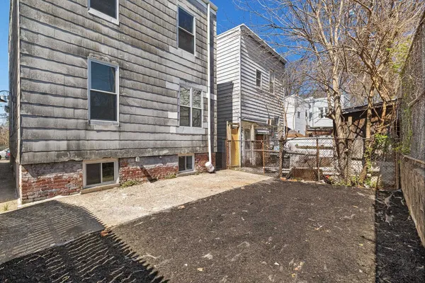 a view of a house with a yard and garage