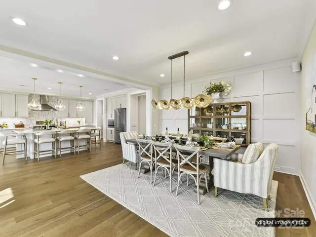 a spacious bedroom with a bed and a large window