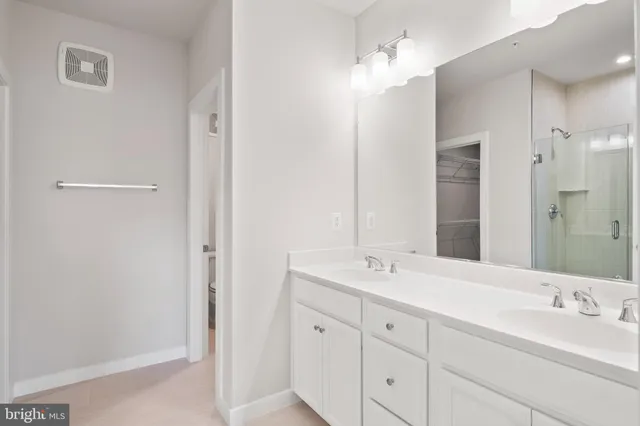 a view of a balcony with wooden floor & fence